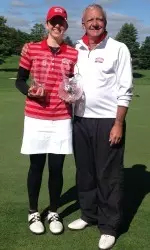 Junior Emily Tillo poses with head coach Bruce Chalas after her victory at the Dartmouth Invitational.