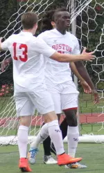 Senior Dominique Badji is greeted by teammates after scoring his third goal of season.
