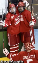 Doyle Somerby (right) celebrates with Jack Eichel (left) and Matt Grzelcyk after the Terriers seal the victory with an empty-netter.