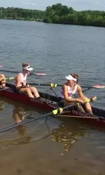 The Terriers' V8 boat celebrates its bronze medal win