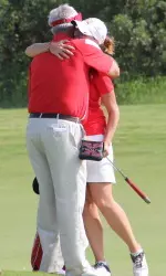 Senior Kristyna Pavlickova hugs head coach Bruce Chalas after she completed her final collegiate round.