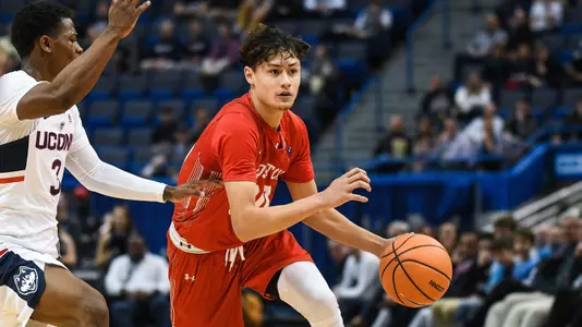 Javante McCoy dribbles past defender vs. UConn
