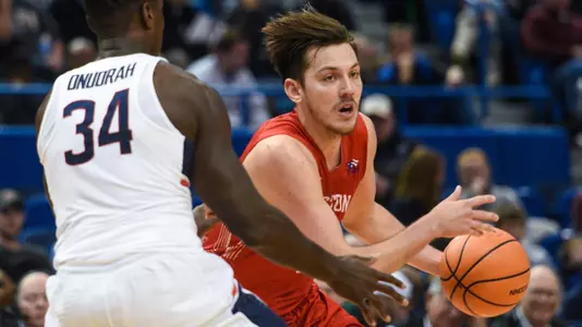 Nick Havener drives at a defender at UConn
