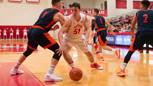 Max Mahoney dribbles past Bucknell defender