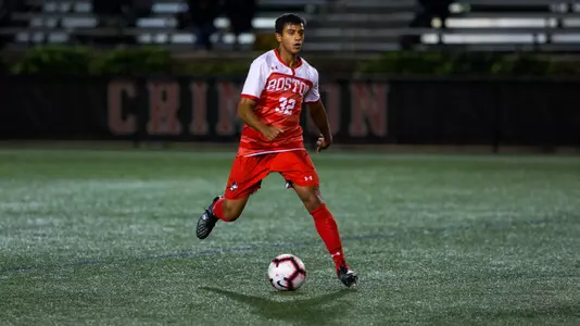 Mana Chavali controls the ball in the middle of the field at Harvard.