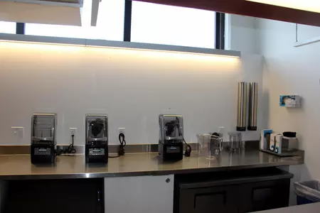 A picture of the kitchen counter within the Terrier Fueling Station. There are a couple of blenders on top.