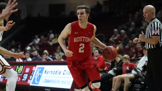 Tyler Scanlon drives toward the hoop at Elon.