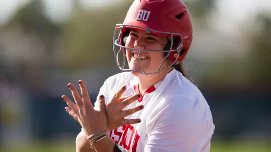 Alex Heinen Smiles with bat wings hand gesture