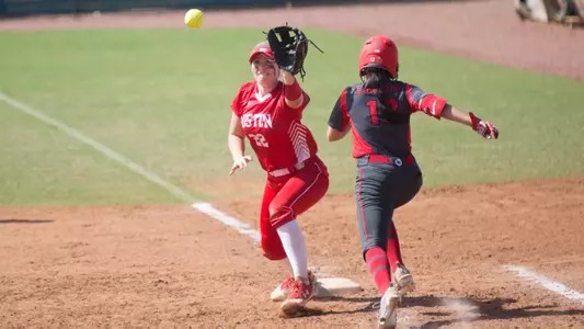 Kaitlin Sahlinger catches the ball at first