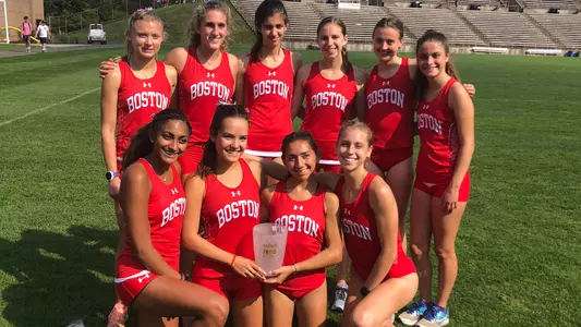 The women's cross country team poses with a trophy after the Paul Short Run