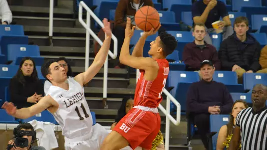 Alex Vilarino attempts a jumper in front of a Lehigh defender at Lehigh.