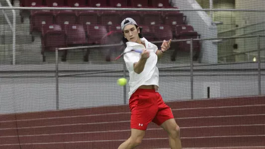 Max Stehling swings a forehand with the racquet