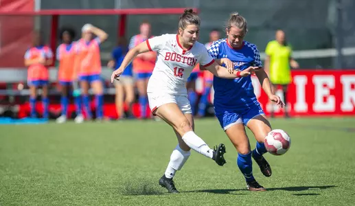 Lauren Adelman kicks the ball.