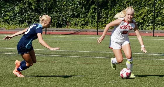 McKenna Kennedy looks to pass the ball.