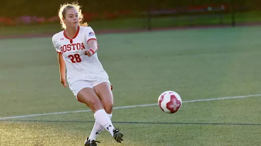 Kayla Ross kicks the ball.