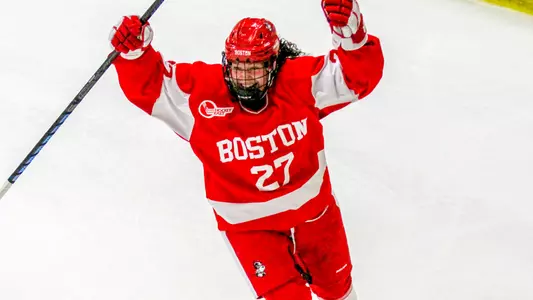 Nara Elia celebrates her overtime-winning goal at Vermont