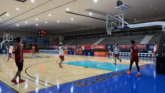 The Boston University men's basketball team is shooting the ball around in practice at the Cancun Challenge court at the Hard Rock Hotel Riviera Maya.
