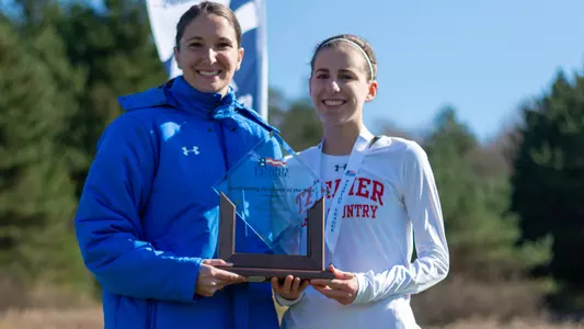 Abigail Gugel is presented with the trophy for Patriot League Most Outstanding Runner of the Year