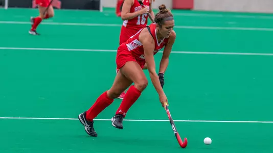 Sophomore Casey Thompson creates open space while dribbling the ball into UNH territory.