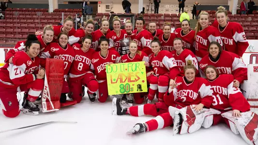 The Boston University women's ice hockey team poses with the Beanpot trophy after the team's victory over Harvard on Feb. 12, 2019.