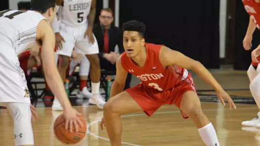 Alex Vilarino is in a defensive position as Lehigh guard brings the ball up the court.