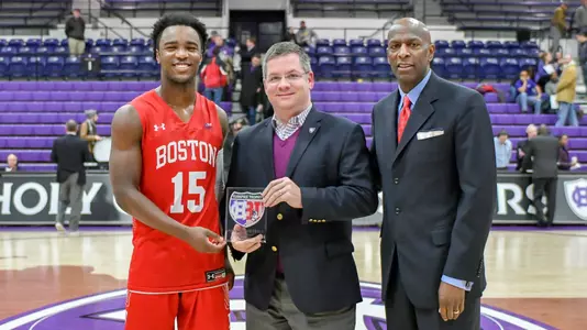 Jonas Harper receives the Turnpike Trophy MVP award with head coach Joe Jones.