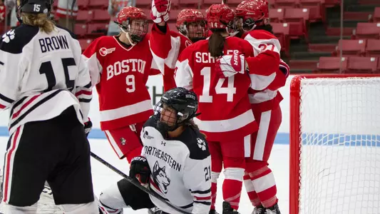 Women's Hockey celebrates goal against Northeastern