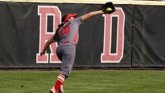Aliyah Huerta-Leipner makes a leaping grab on a liner in the outfield