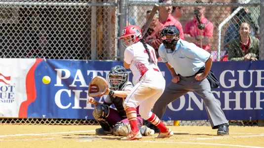 Alex Ponce watches the ball go by her.