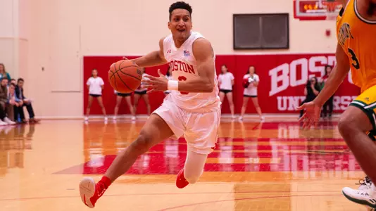 Alex Vilarino dribbles towards the basket