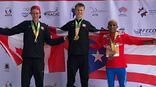 Foster Malleck on medal stand at U20 Pan American Championships