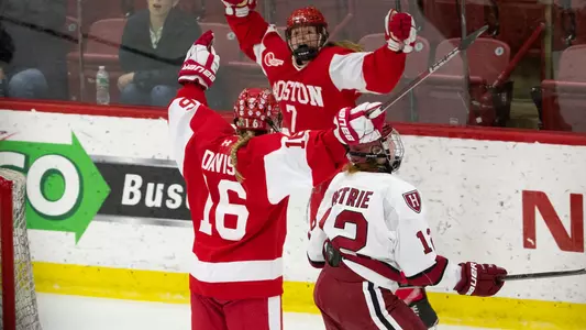 Sammy Davis and Jesse Compher celebrate Davis' game-winning goal in the Beanpot final