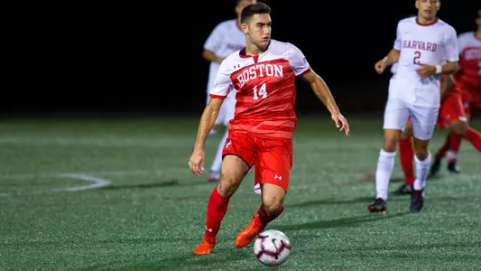 Gent Celaj dribbles the ball upfield.