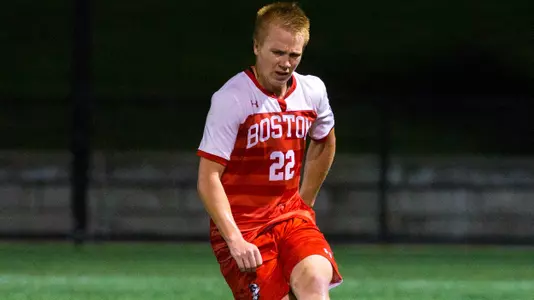 Nate Colepasses the ball down the field.