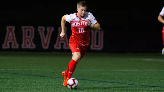 Toti Knutsson dribbles down the field.