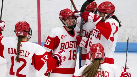 The women's ice hockey team celebrates a goal