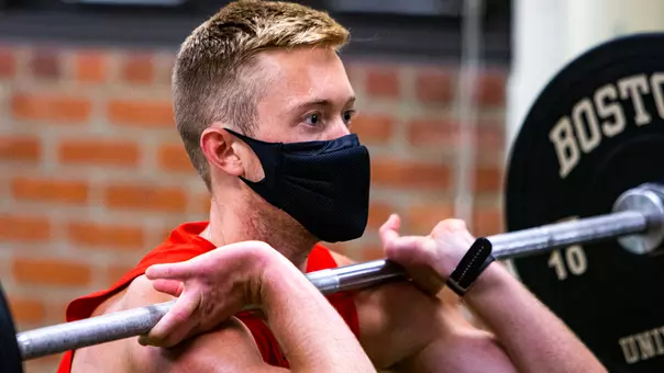 A Terrier student-athlete working out in the strength and conditioning room