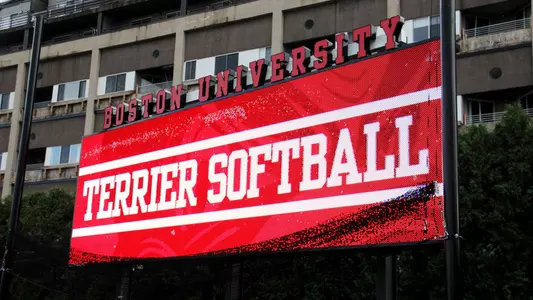 Angled view of the new BU Softball Videoboard. It is displaying a graphic that says Terrier Softball.