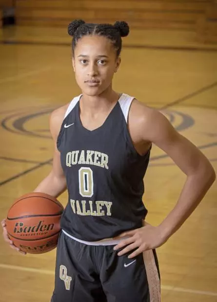 Corrine Washington posing with a basketball