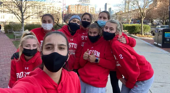 Members of the women's lacrosse team posing for a photo during a virtual 5K