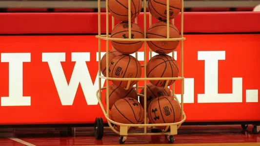 Basketball ball carousel stationed in front of a press table