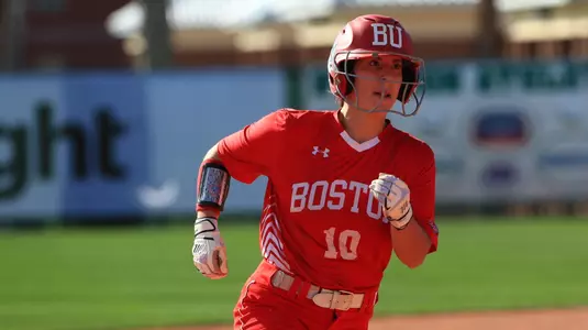 Aliyah Huerta-Leipner runs toward third base from second.