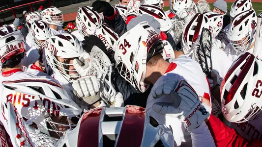 Men's Lacrosse Team Huddles Together