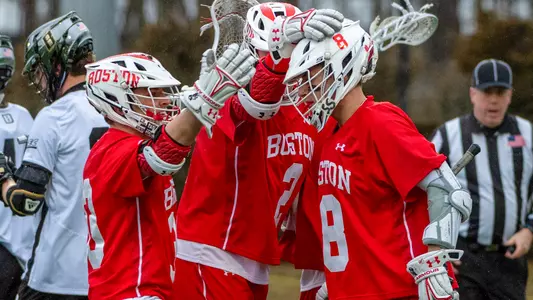 The men's lacrosse team celebrates a goal