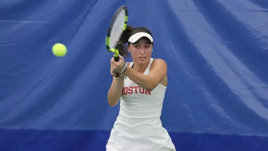 Erica Di Battista uses her backhand to hit the ball.