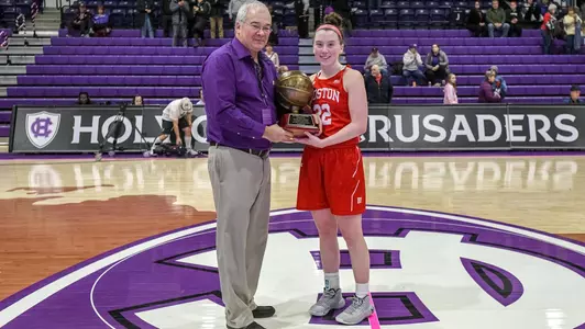 Maggie Pina being presented with an MVP trophy