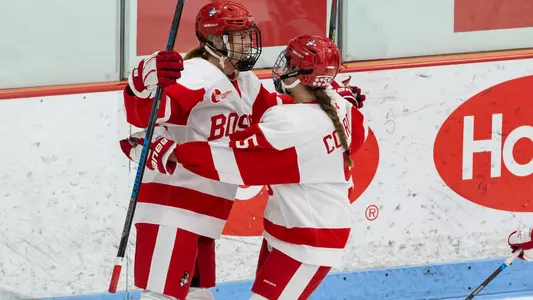 Jesse Compher and Courtney Correia celebrate a goal