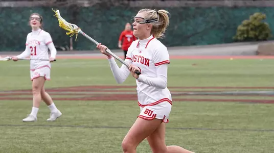 Claire Gola running down the field with the ball