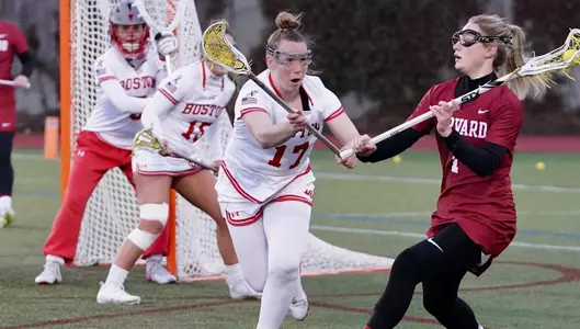 Maggie Lohrer guarding a Harvard player