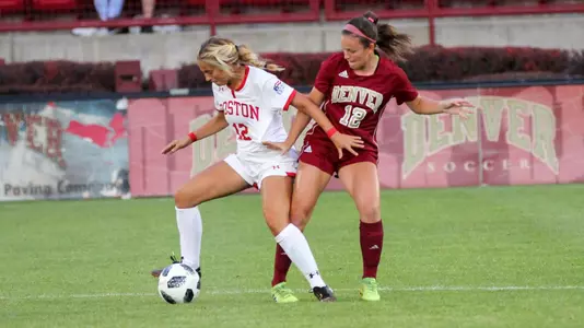 Kelly Park fighting for the ball against a Denver defender